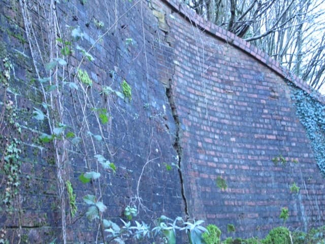 Cracks in Elmbridge Bridge Cranleigh from Downs Link